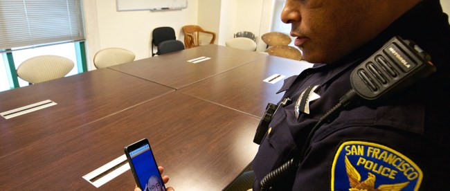 a San Francisco Police Department officer is seen holding his phone and interacting with a sign language interpreter through the app in order to provide better communication to deaf community members.