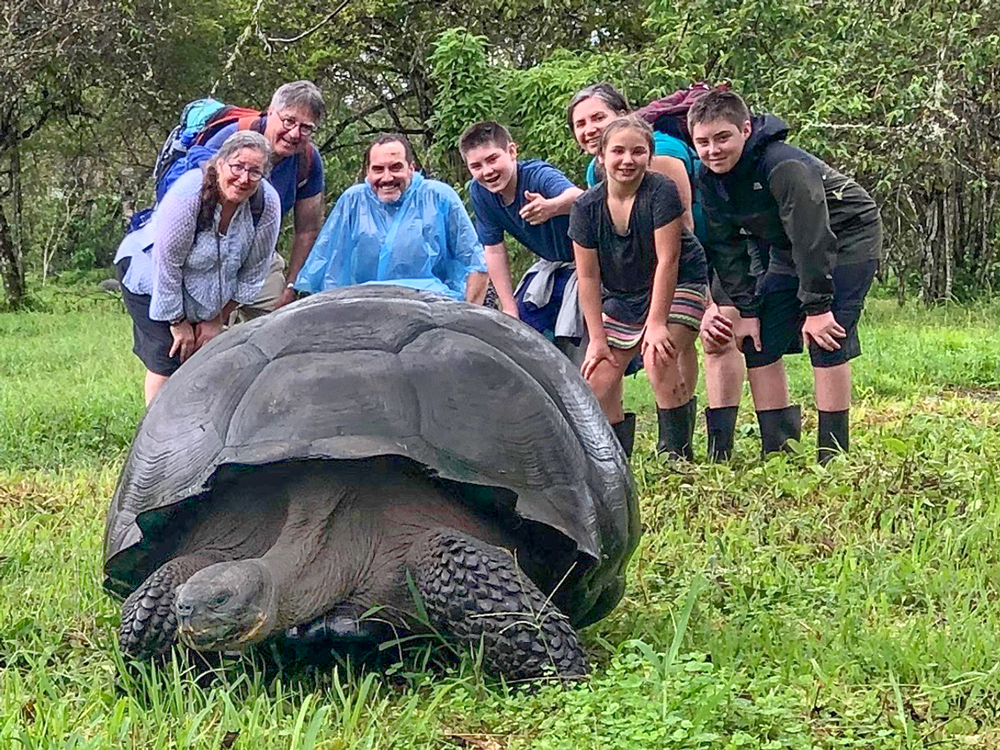The Woodbury clan poses behind one of the famed Galápagos tortoises.