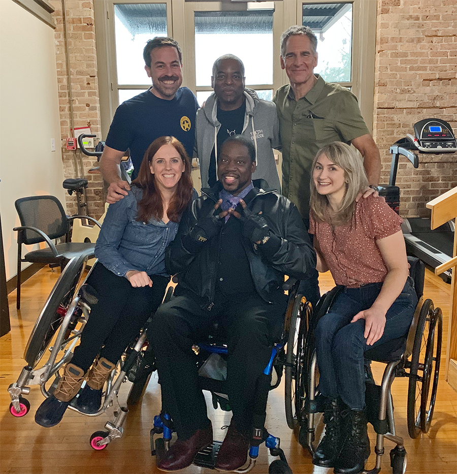 This photo captures a rare scene that hopefully will become more common, as everyone in the front row worked on a popular TV series episode. Katherine Beattie wrote it, Daryl “Chill” Mitchell starred in it, and Teal Sherer guest-starred in it. In the back row are Kurt Yaeger, LeVar Burton and Scott Bakula.