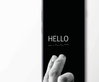 image of a samsung phone with the good vibes app interface. It displays the word hello in english and morse code. Someone's fingers are resting on the phone as if they just tapped the word.
