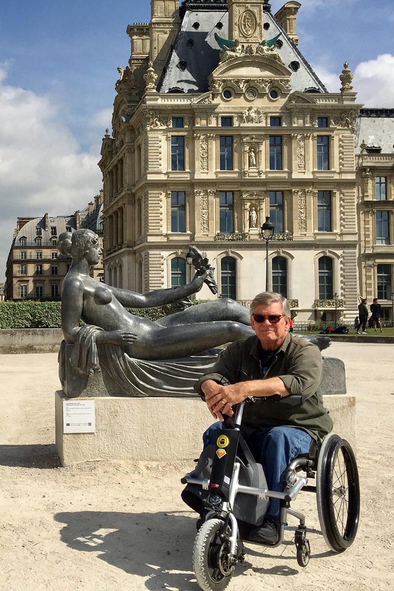With his Firefly, Alan Toy could whip from one famous museum to another. Here he is outside the Louvre.
