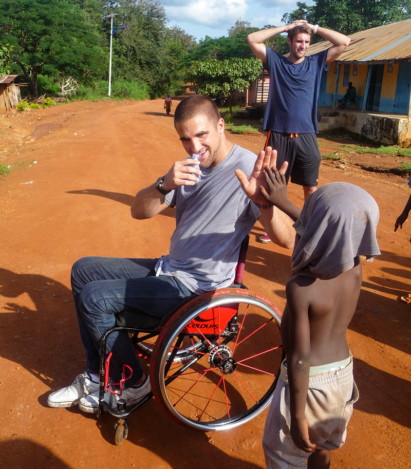 Jake Robinson trekked through a village in Ghana, where he met this young man giving him a high-five.